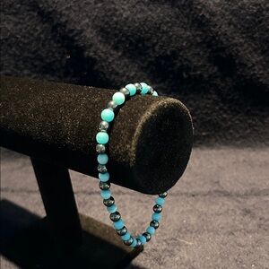 Bracelet. Long blue and smoke beads.